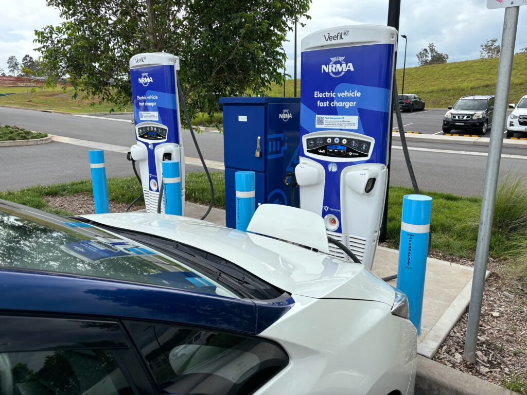 A Nissan Leaf connected to one of two NRMA electric vehicle chargers.