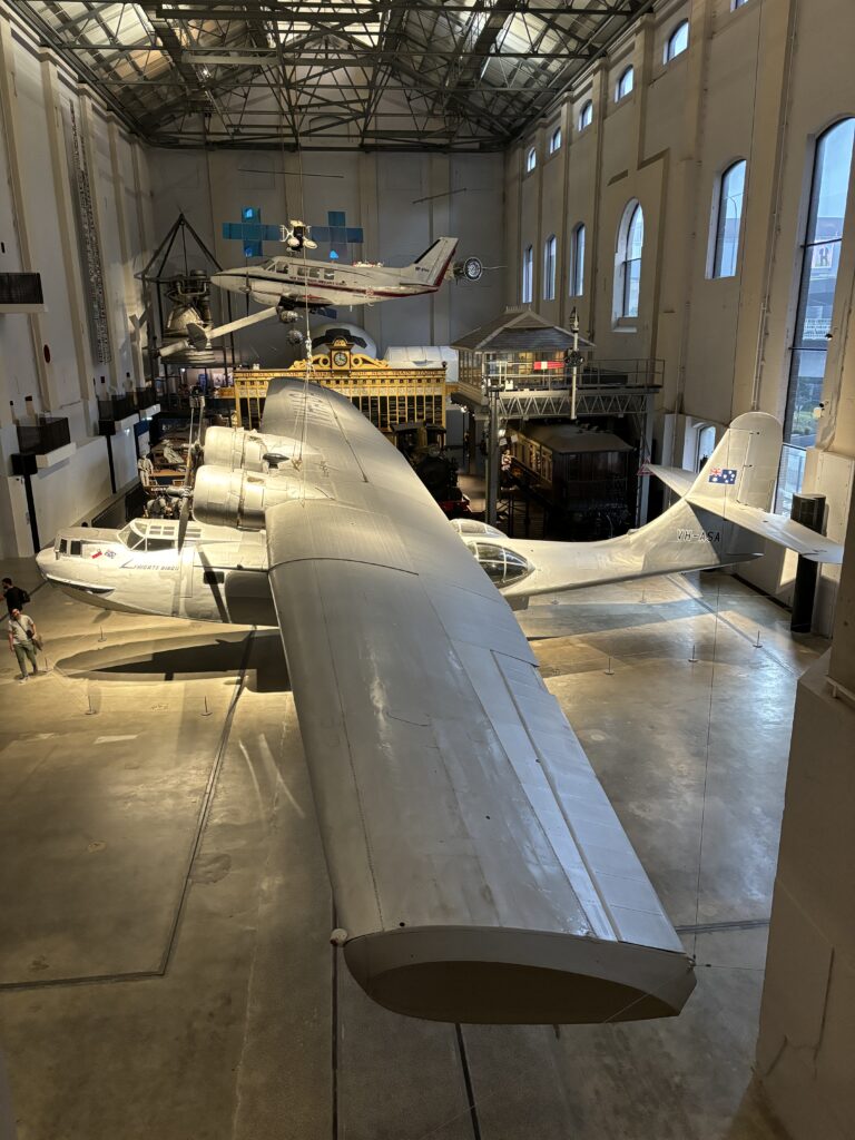 The "Frigate Bird II" Catalina seaplane sits alongside other transport displays in the Powerhouse Museum.