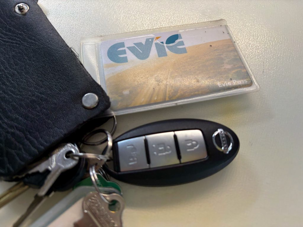 A Evie Pass RFID card exposed from a card holder wallet.